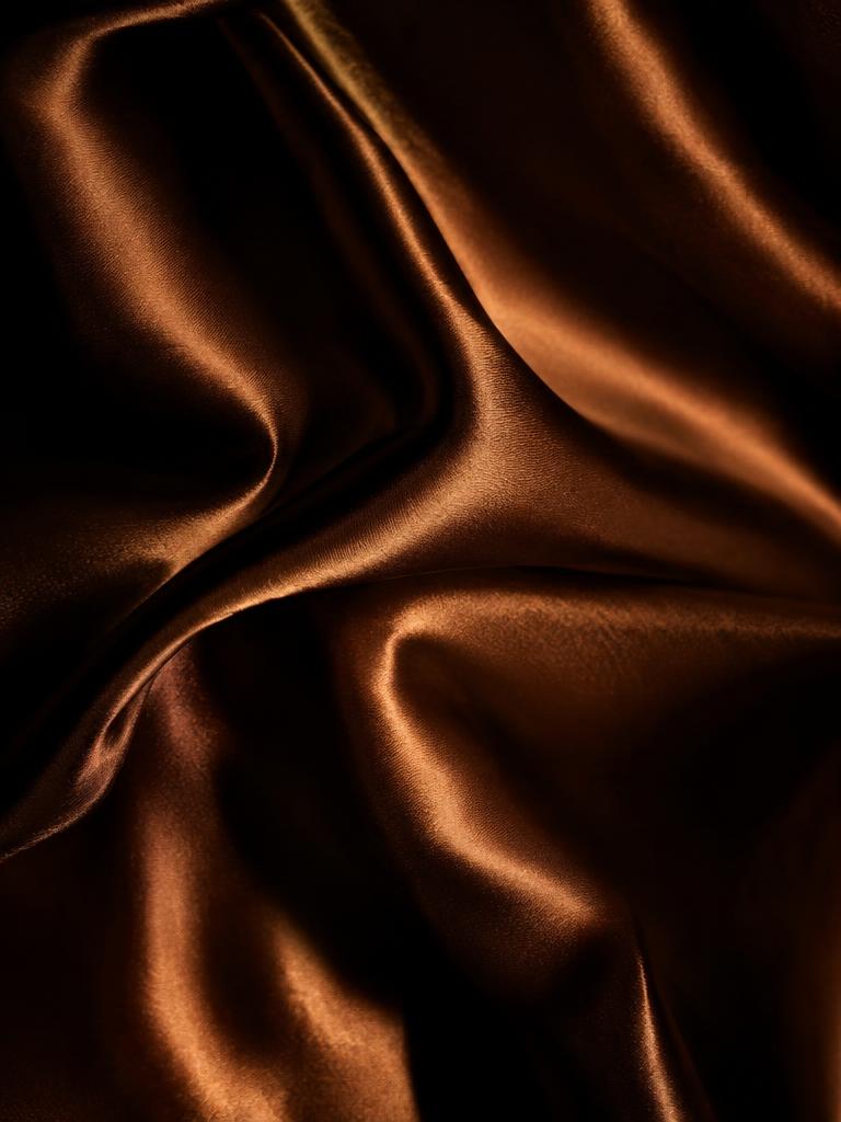 Deep bronze satin representing a rich, deep spray tan finish